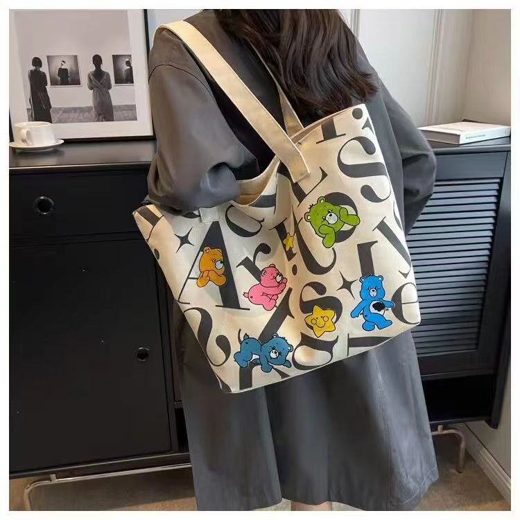 2025 autumn new student canvas bag, lightweight bag and large capacity handbag, simple and niche commuter casual handbag, designer shoulder bag