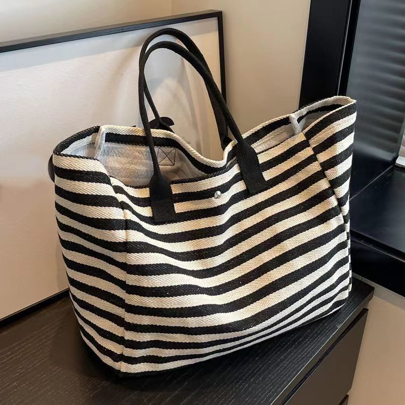 2025 autumn new canvas bag, fashionable commuting bag, simple and niche design, women's large bag capacity handbag, striped designer shoulder bag