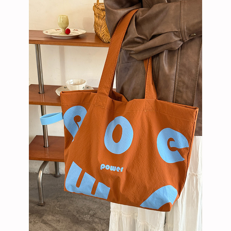2025 Autumn New Korean Letter Drawstring Design Simple, Small, bag Lightweight, Large Capacity Casual Shoulder Designer Shoulder Bag Women's Canv
