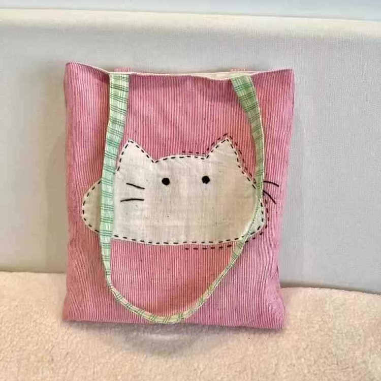 2025 autumn new Japanese style shoulder bag lightweight, niche, simple canvas women's bag cute cartoon bag cat head pink shoulder bag designer ca