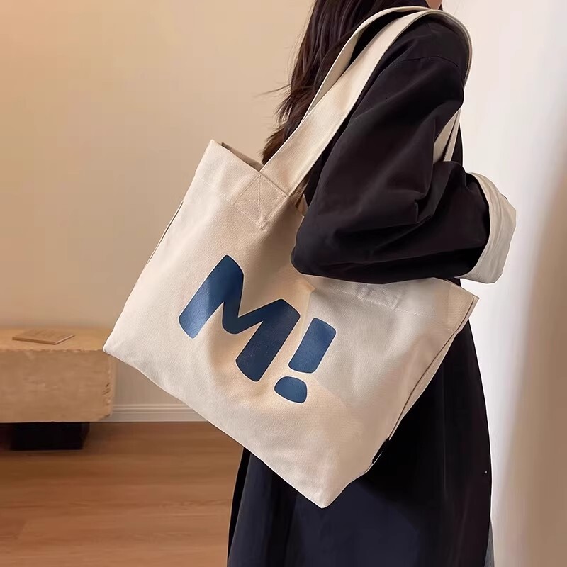 2025 autumn new student canvas bag, bag large capacity, simple and niche design, lightweight commuting bag, handbag designer shoulder bag