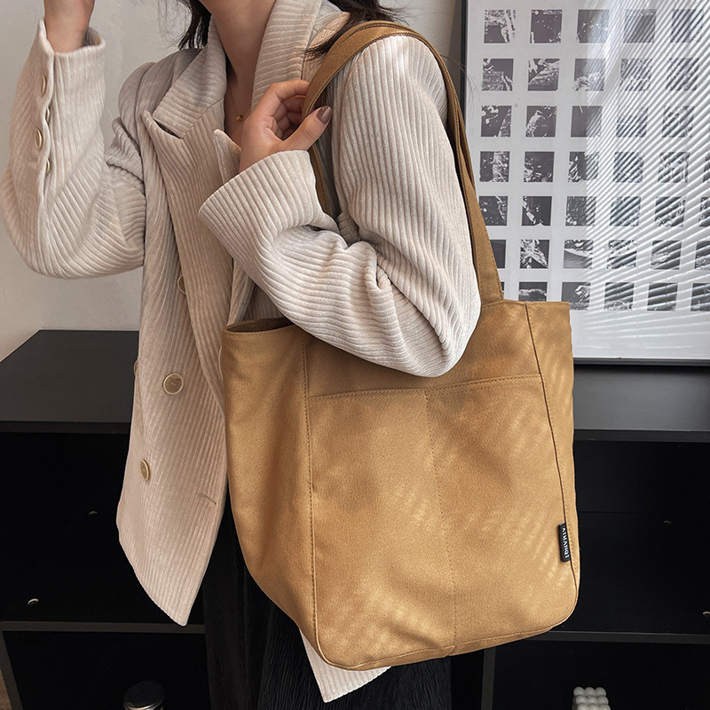 2025 autumn new women's canvas bag with large capacity, simple and bag niche design, commuting handbag, student shoulder bag, designer canvas bag