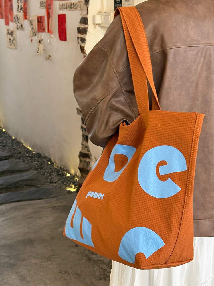 2025 Autumn New Korean Letter Drawstring Design Simple, Small, bag Lightweight, Large Capacity Casual Shoulder Designer Shoulder Bag Women's Canv