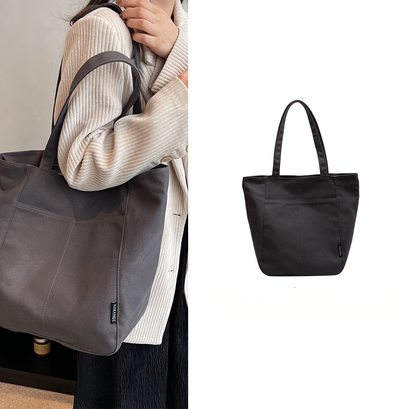 2025 autumn new women's canvas bag with large capacity, simple and bag niche design, commuting handbag, student shoulder bag, designer canvas bag