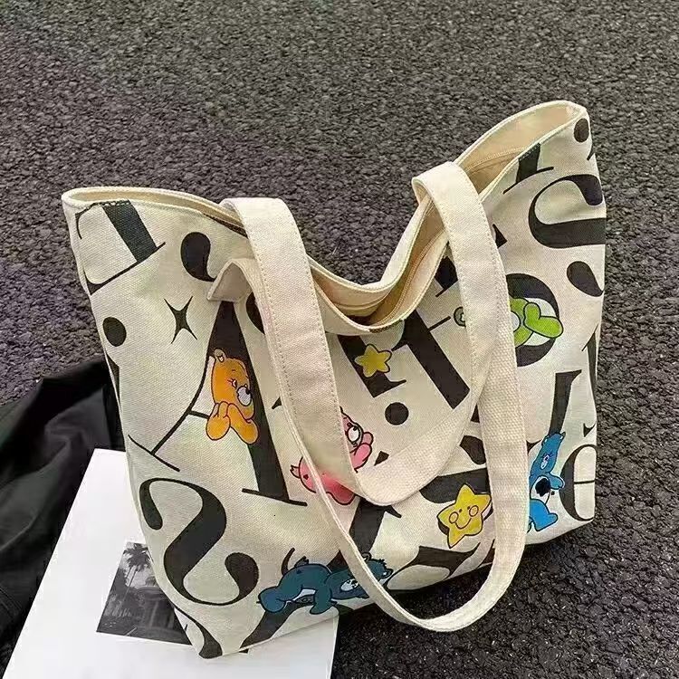 2025 autumn new student canvas bag, lightweight bag and large capacity handbag, simple and niche commuter casual handbag, designer shoulder bag