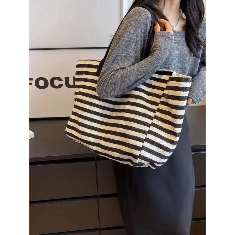 2025 autumn new canvas bag, fashionable commuting bag, simple and niche design, women's large bag capacity handbag, striped designer shoulder bag