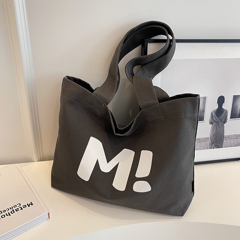 2025 autumn new student canvas bag, bag large capacity, simple and niche design, lightweight commuting bag, handbag designer shoulder bag