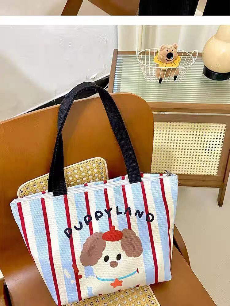 2025 autumn bag new minimalist style fashionable niche design handheld cute puppy style lightweight college canvas bag designer handbag