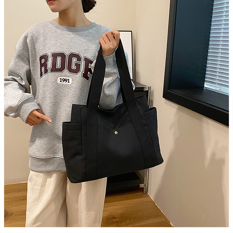 2025 autumn new large capacity canvas handbag lightweight niche design simple commuting bag designer shoulder bag women's bag canvas bag