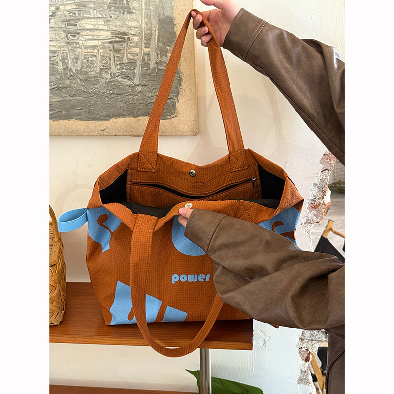 2025 Autumn New Korean Letter Drawstring Design Simple, Small, bag Lightweight, Large Capacity Casual Shoulder Designer Shoulder Bag Women's Canv