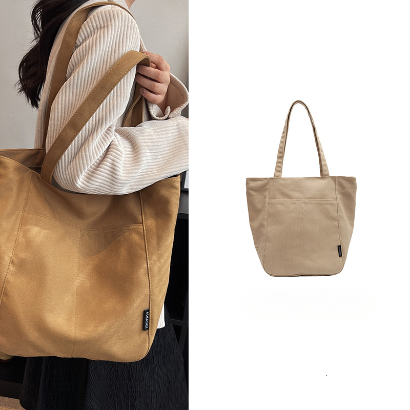 2025 autumn new women's canvas bag with large capacity, simple and bag niche design, commuting handbag, student shoulder bag, designer canvas bag
