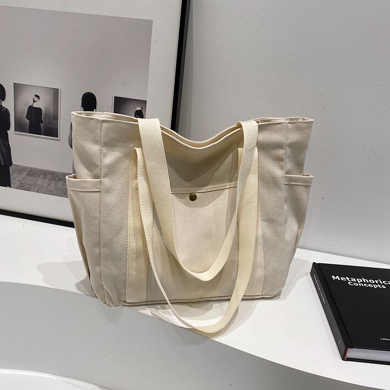 2025 autumn new large capacity canvas handbag lightweight niche design simple commuting bag designer shoulder bag women's bag canvas bag