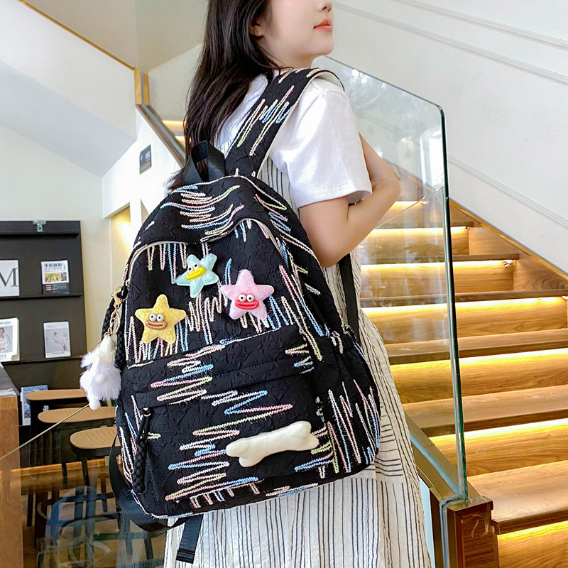 2025 autumn new lightweight and simple Japanese style versatile backpack niche style college atmosphere student design sense travel backpack designer 