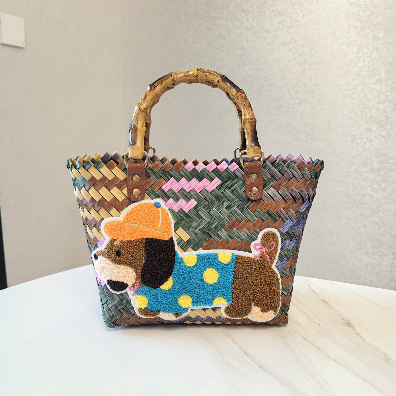 2025 autumn new retro striped sausage dog woven bag bag with simple and niche design, nylon rope pendant, women's handbag designer beach bag