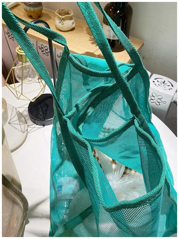 2025 autumn new niche style transparent mesh simple shoulder bag fashionable, lightweight, large bag capacity beach bag designer canvas bag
