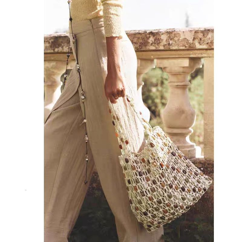 2025 autumn new women's bag light luxury atmospheric bead bag, simple and fashionable, niche woven bag, checkered beach bag, designer shoulder ba