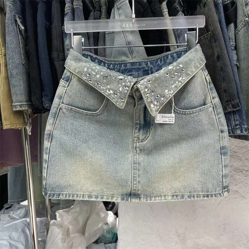 Cool collar designer women's short denim skirt 2025 summer new spicy girl high waist light blue denim skirt