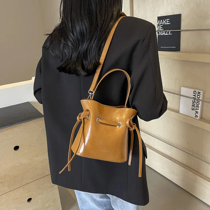 LEFTSIDE Mini PU Leather Tie Rod Cross body Bag Womens Fashion Womens Bucket Bag Womens Shoulder Bag Silver Handbag 250303
