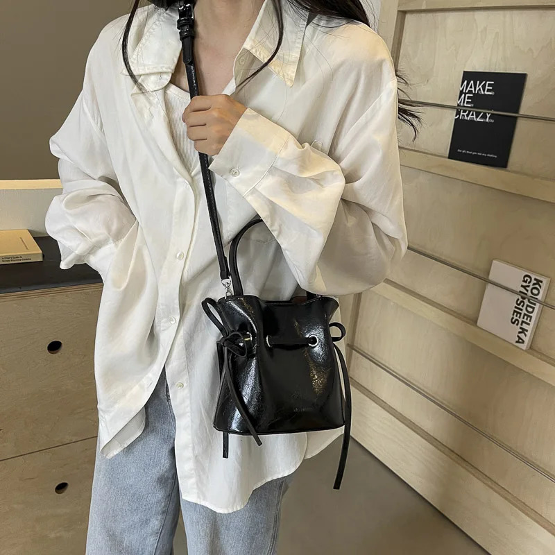 LEFTSIDE Mini PU Leather Tie Rod Cross body Bag Womens Fashion Womens Bucket Bag Womens Shoulder Bag Silver Handbag 250303