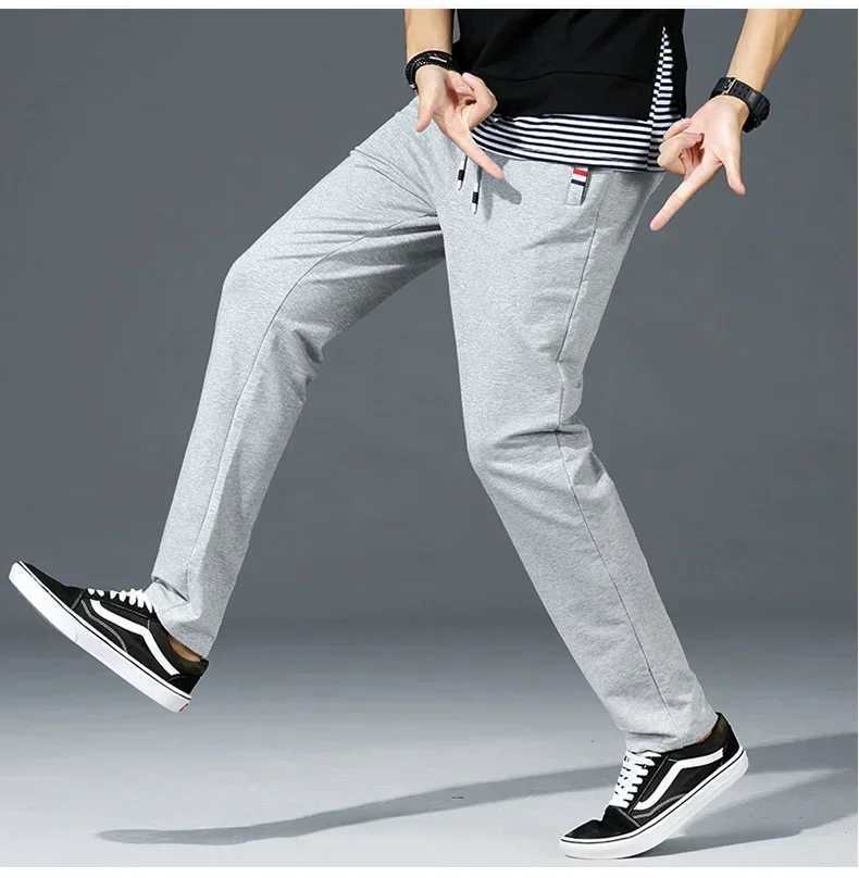 Spring Pants mens fitness sportswear elastic waist sports pants cotton Trouser loose gym jogging pants M-8XLXJ250303