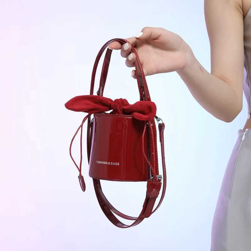 Mini Exquisite Wine Red Glossy Lacquer Surface Crossbody Bag 2024 New Bow Drawstring Underarm Bags High Street Lipstick Handbag Z250303