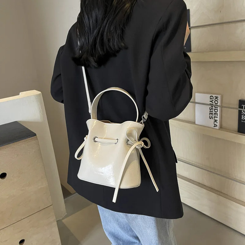 LEFTSIDE Mini PU Leather Tie Rod Cross body Bag Womens Fashion Womens Bucket Bag Womens Shoulder Bag Silver Handbag 250303