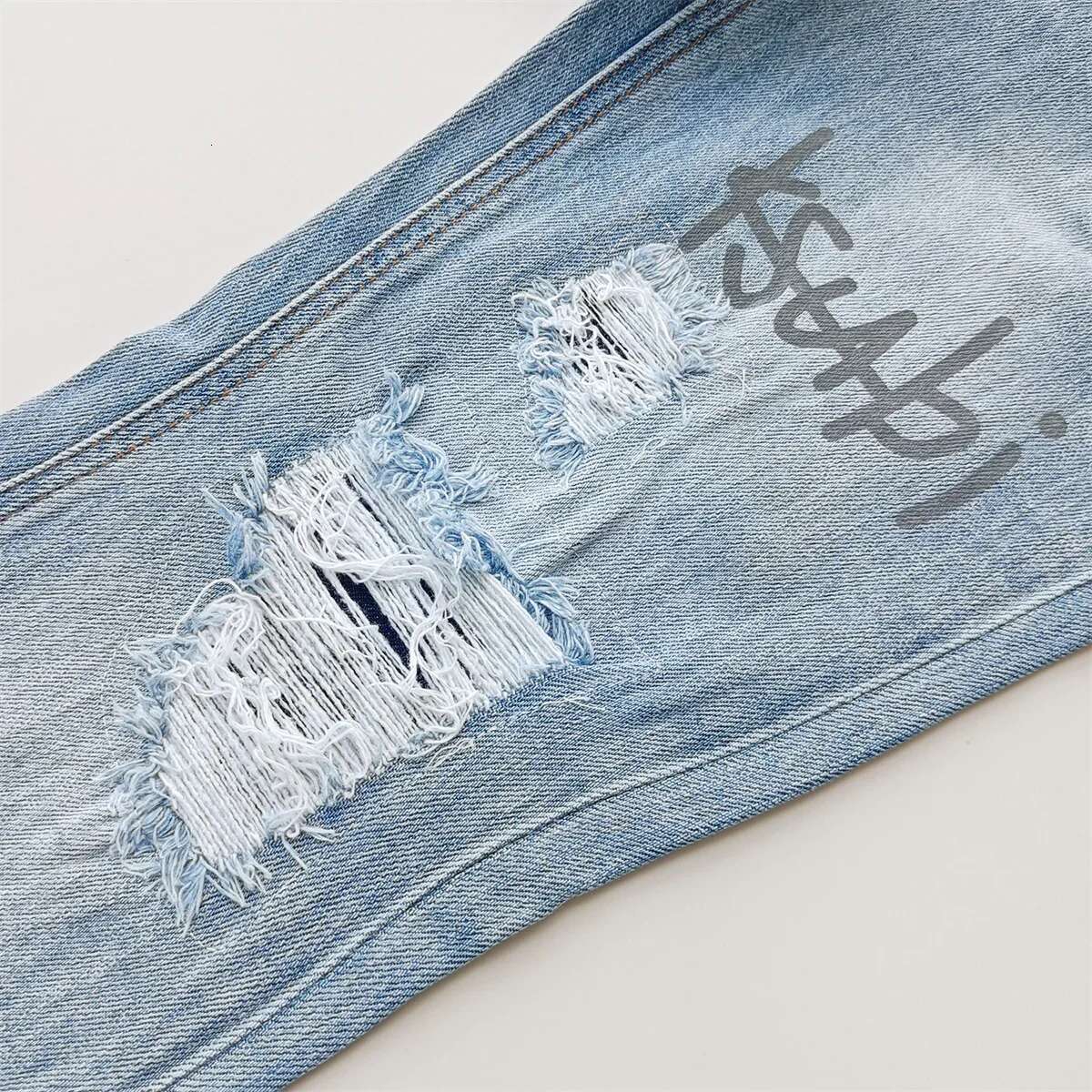 KSUBI Cross Men Fashion Trend Wash Light Blue Letter Print Low Rise Elastic Skinny Pants Daily Casual Ripped Frayed Jeans