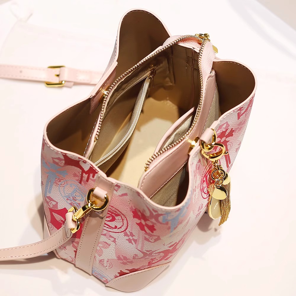 2025 Stylish Bucket Handbag Featuring a Dainty Tassel Pendant and Distinctive Print Pattern crafted from high - quality leather
