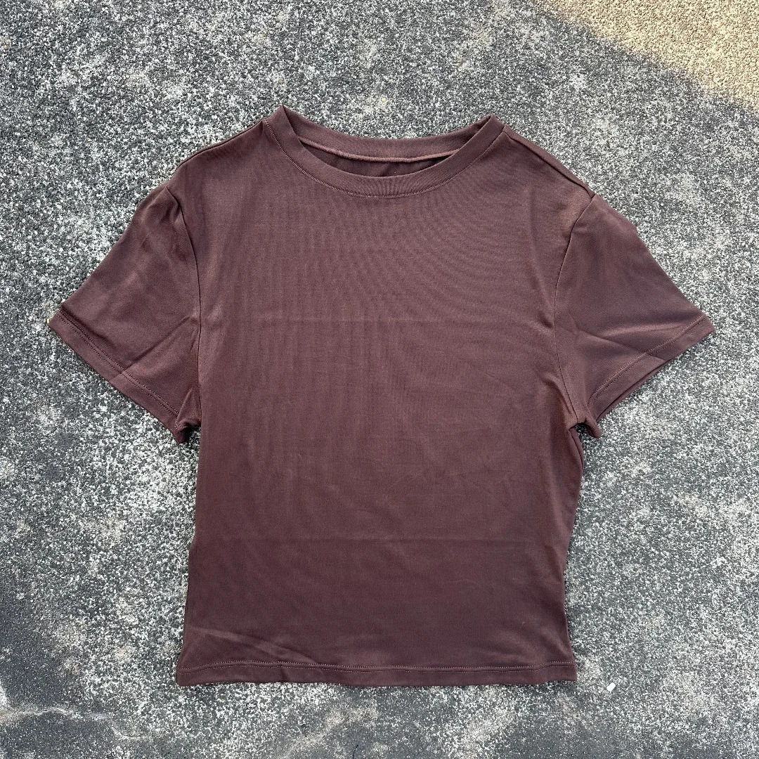 Solid color womens soft breathable yoga short-sleeved comprehensive training tight T-shirt with exposed belly button fitness sh 250303