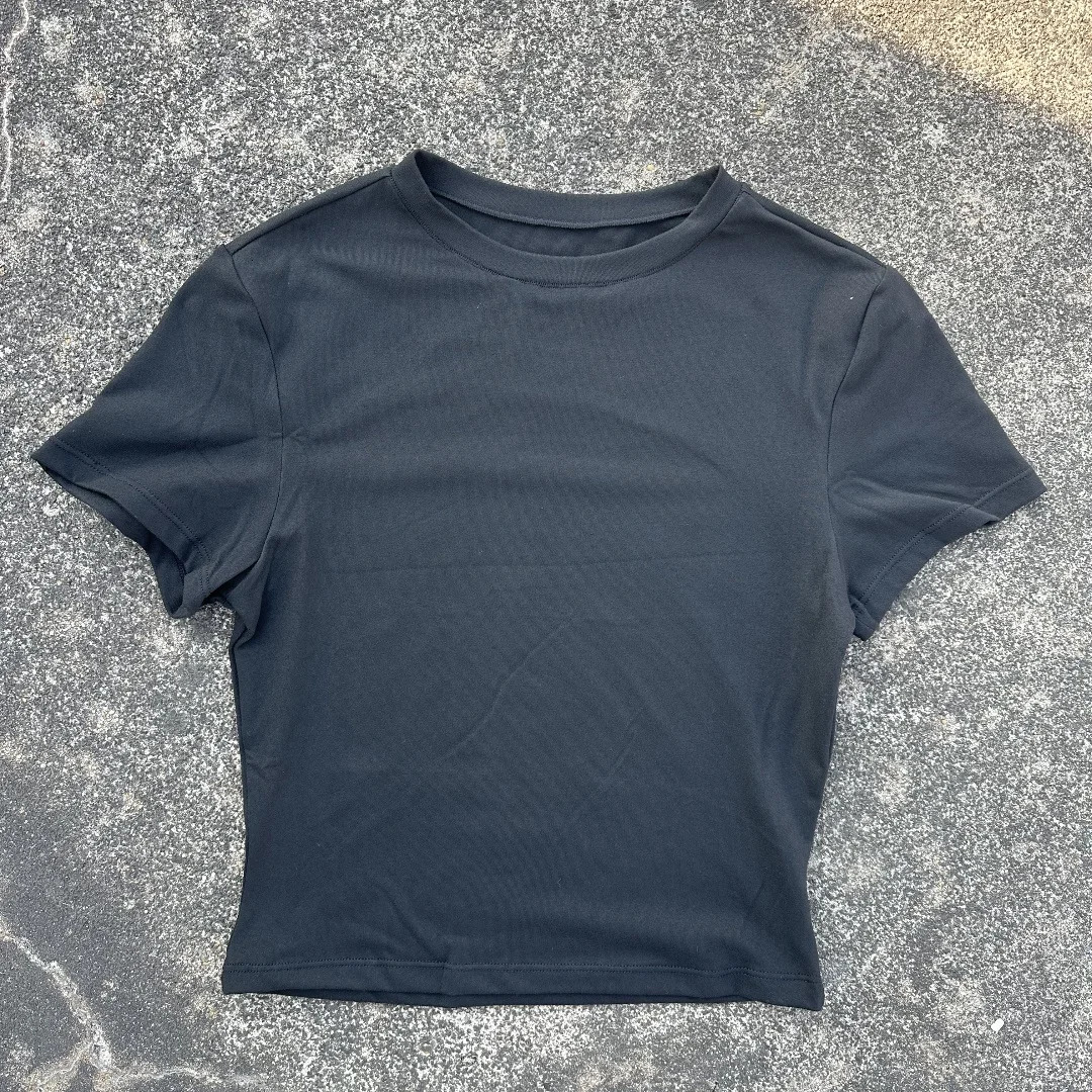 Solid color womens soft breathable yoga short-sleeved comprehensive training tight T-shirt with exposed belly button fitness sh 250303