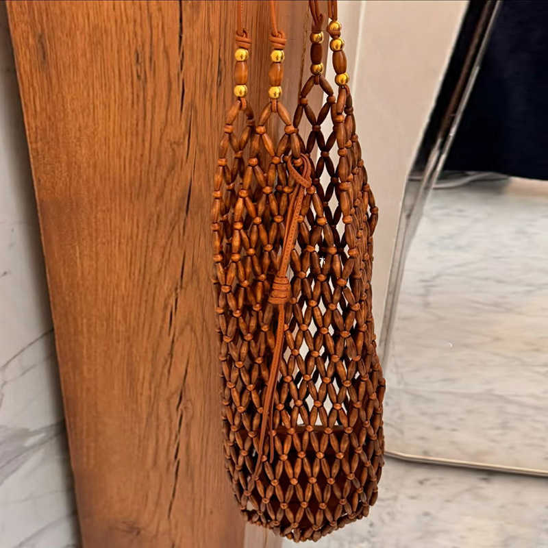 Ins Hollowed Out Handmade Woven Bag, Female Niche Design, Wooden Bead Bucket Bag, Summer Versatile Commuting Single Shoulder Women's Bag 250315
