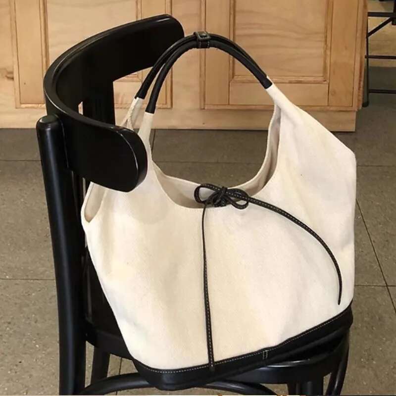 New Large Capacity Bow Bucket Canvas Women 2025 Retro Commuter Shoulder Underarm Tote Bag