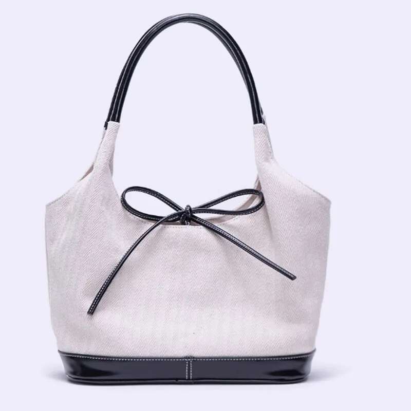 New Large Capacity Bow Bucket Canvas Women 2025 Retro Commuter Shoulder Underarm Tote Bag