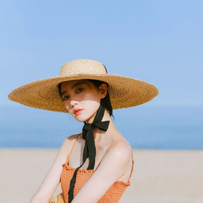 Summer Big Natural Straw Hats For Women Handmand Wide Brim Beach Visor Caps Elegant Flat Top Long Ribbon Lace-Up Sun Hat250305
