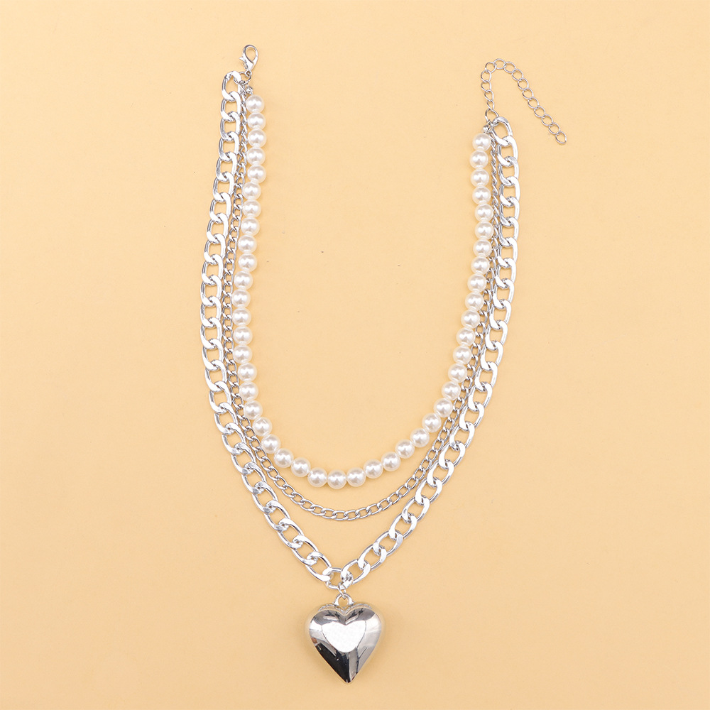 Multi-layer pearl love pendant necklace splicing metal chain bright surface versatile temperament ins necklaces in Europe and the United States fashio
