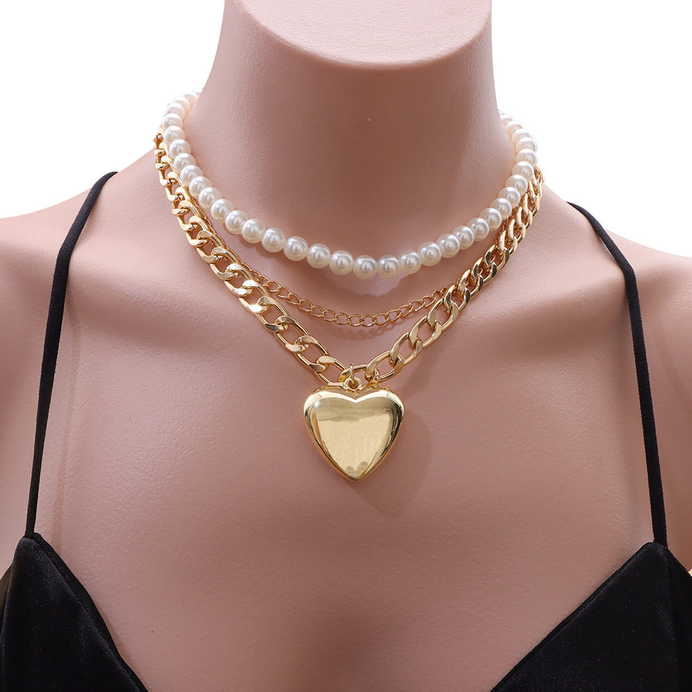 Multi-layer pearl love pendant necklace splicing metal chain bright surface versatile temperament ins necklaces in Europe and the United States fashio
