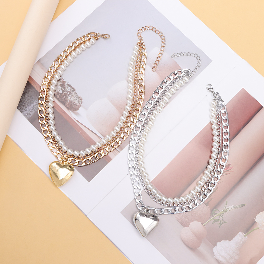 Multi-layer pearl love pendant necklace splicing metal chain bright surface versatile temperament ins necklaces in Europe and the United States fashio