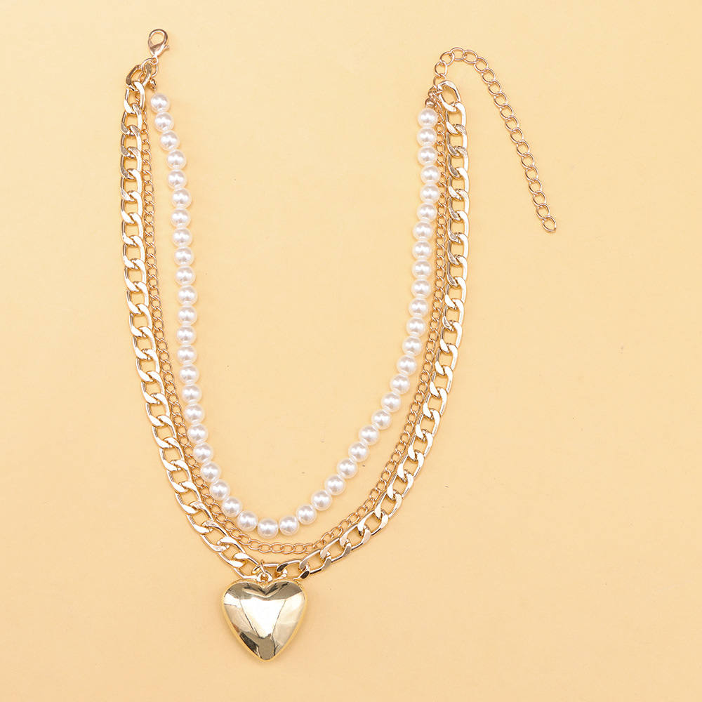 Multi-layer pearl love pendant necklace splicing metal chain bright surface versatile temperament ins necklaces in Europe and the United States fashio