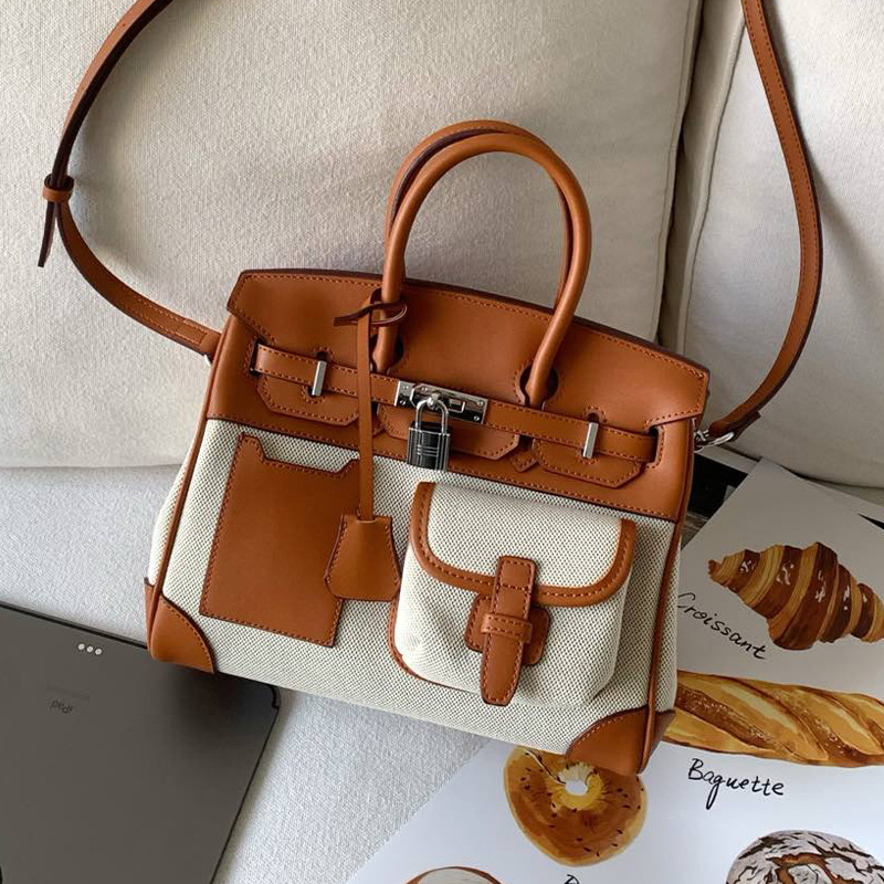 2025 New Color Contrast Canvas Splicing High Quality Leather Large Capacity Handheld Bag Crossbody Bag Senior Designer Women s Fashion Pocket Bag High