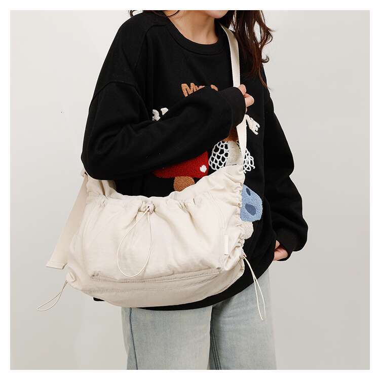 Spring nylon crossbody for both men women, lightweight and large capacity casual backpack, versatile commuting dumpling bag