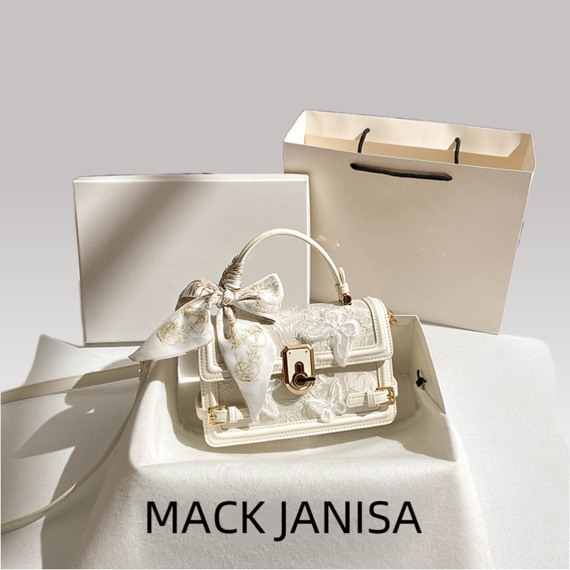 This handbag features intricate embossing and a chic striped ribbon Its gold clasp adds luxury Ideal for daily parties or banquets a global fashion st