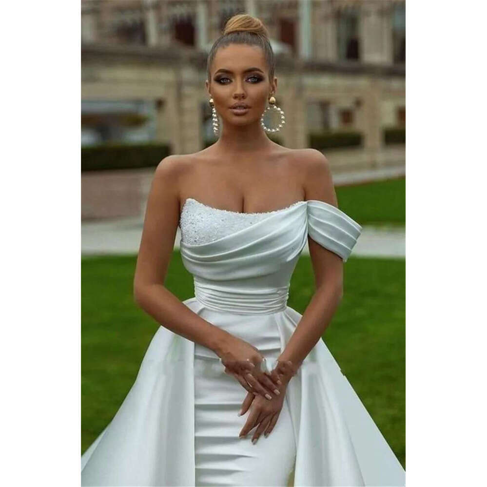 Arabic Stunning ASO EBI Dubai White Ivory Wedding Dresses Sexy Mermaid Off Shoulder Backless Sequins Beads Pleats Ruffles Long Bridal Gowns Robes BC