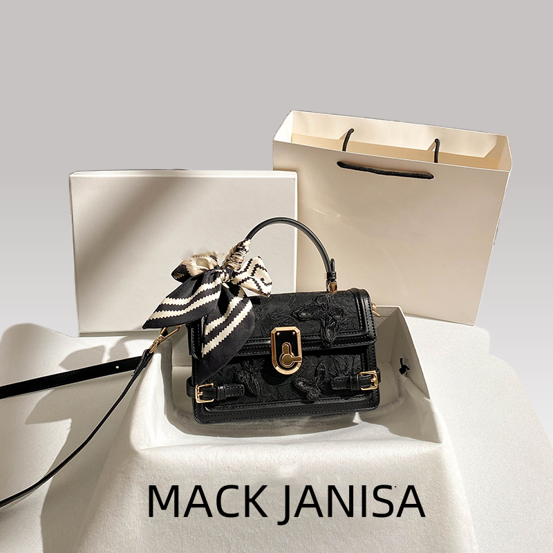 This handbag features intricate embossing and a chic striped ribbon Its gold clasp adds luxury Ideal for daily parties or banquets a global fashion st
