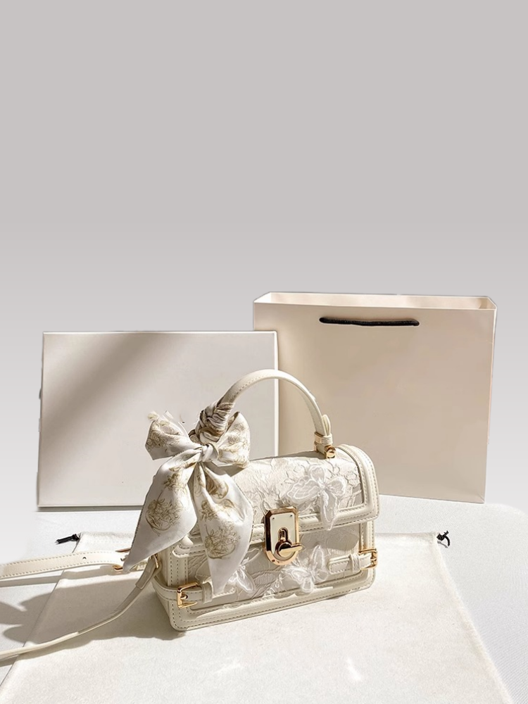 This handbag features intricate embossing and a chic striped ribbon Its gold clasp adds luxury Ideal for daily parties or banquets a global fashion st