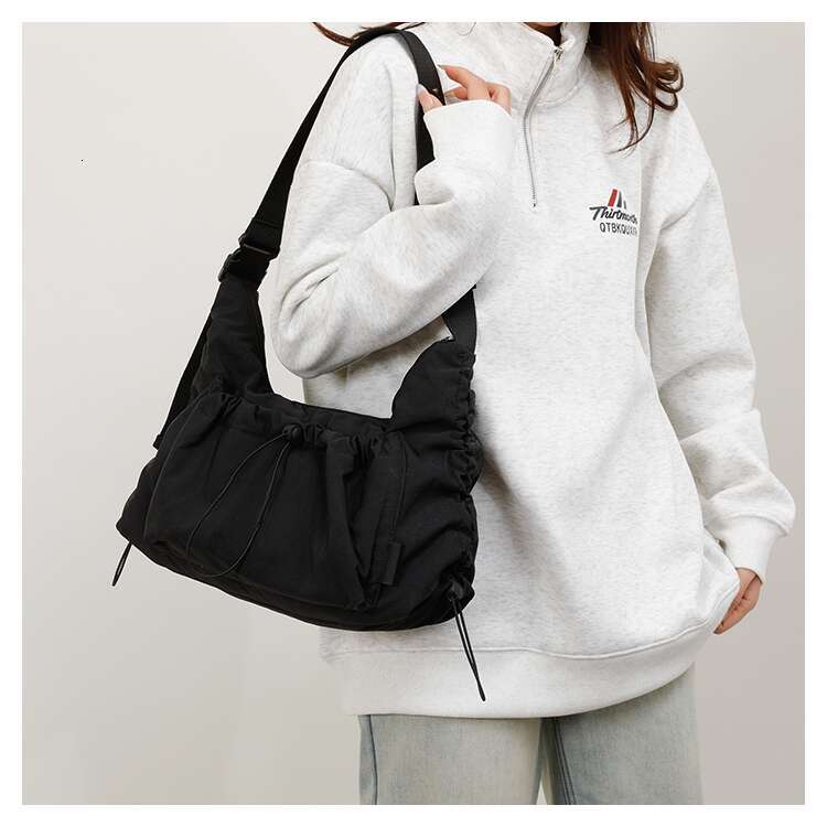Spring nylon crossbody for both men women, lightweight and large capacity casual backpack, versatile commuting dumpling bag