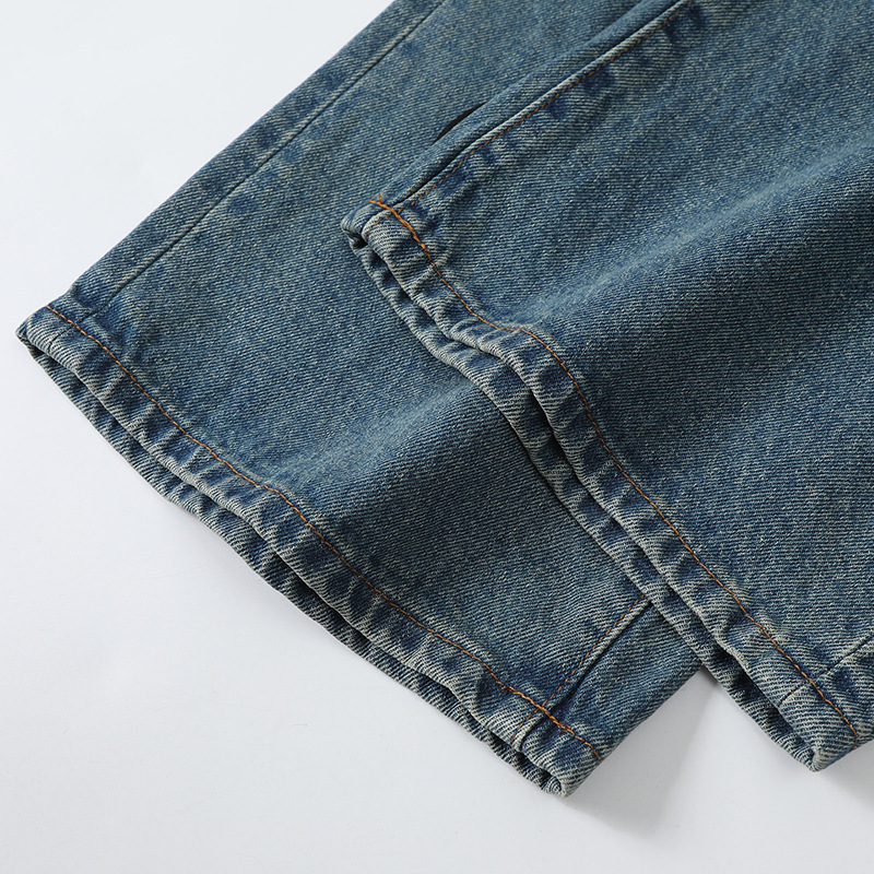 AM New Street Blue Splicing Embroidered Badge Small Foot Micro Elastic Men s Middle Waist Jeans Fashion Designer 2025 New Outdoor Casual Pants