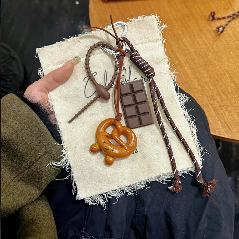 Cute and exquisite woven rope alkaline bread bag chocolate spring buckle pendant highquality 250311