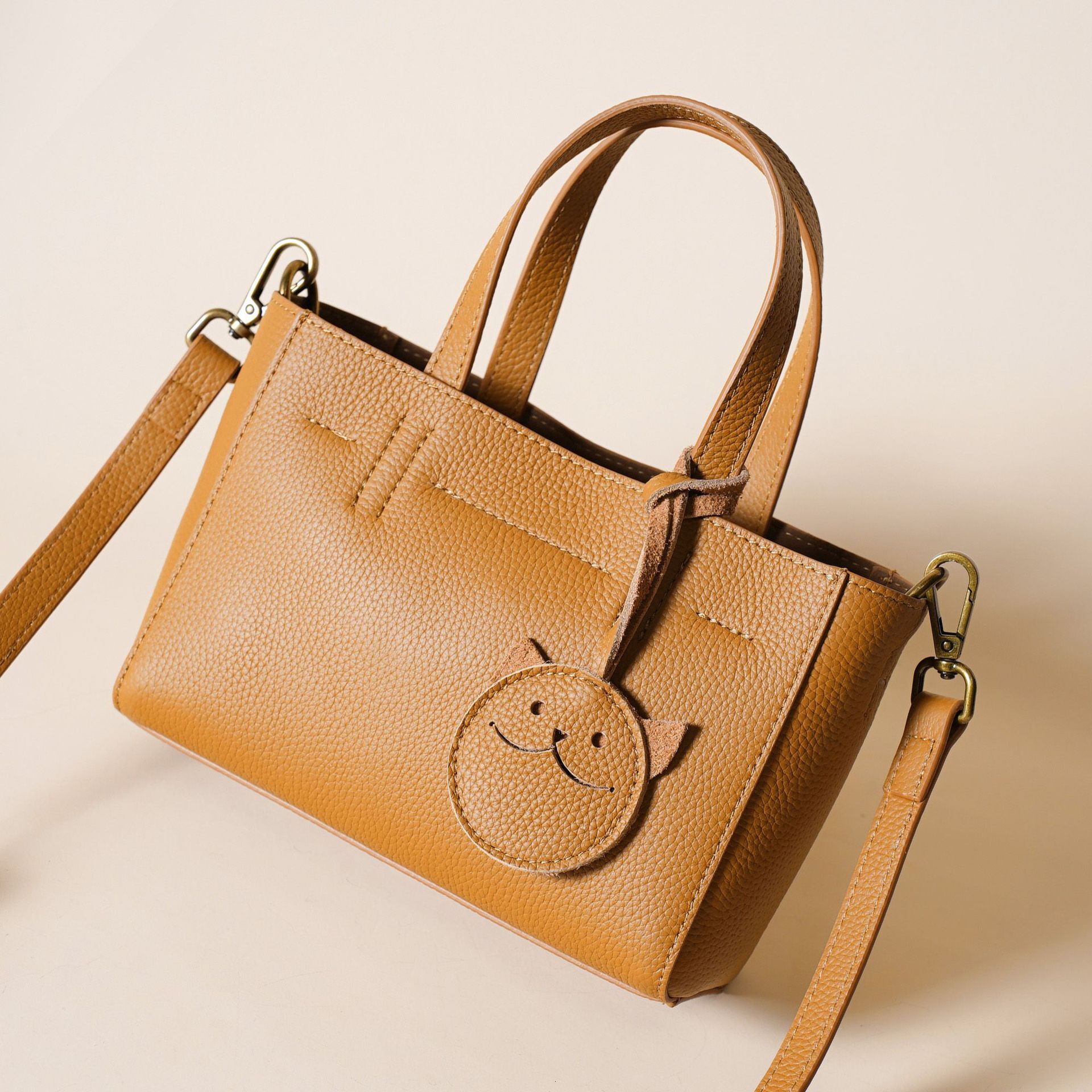 First Layer New Texture High-End Temperament Genuine Leather Women's Cowhide Smiling Face Hand-Held Shoulder Crossbody Bag