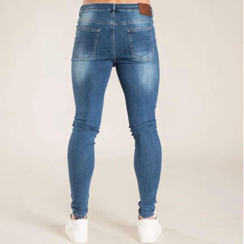 2025 Men s Elastic Tight Pants Solid Color Elastic Pencil Pants Street Wear Men s Blue Black Jeans Fashion Designer High Quality Cotton Jogging Outdoo