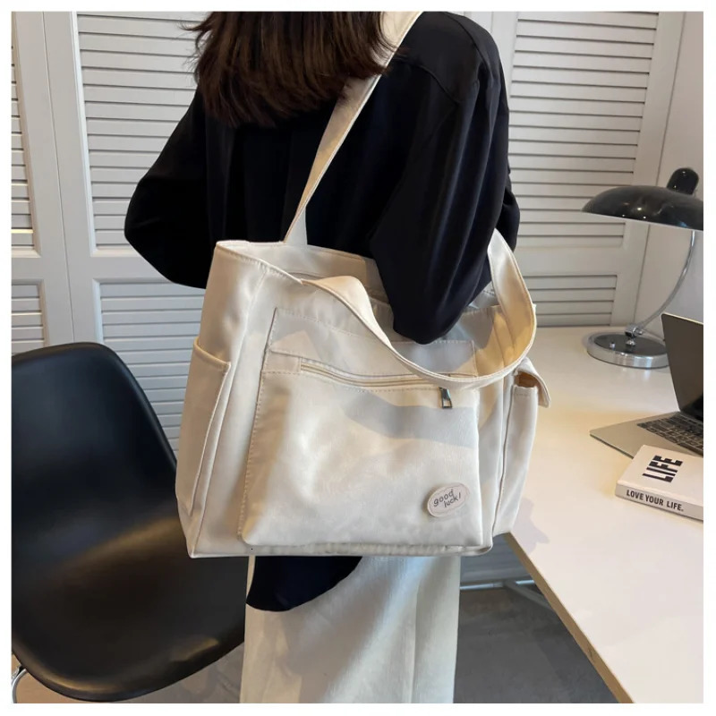 Womens bag fashionable large capacity student Oxford canvas handbag Mom casual shopping armpit multifunctional 250304